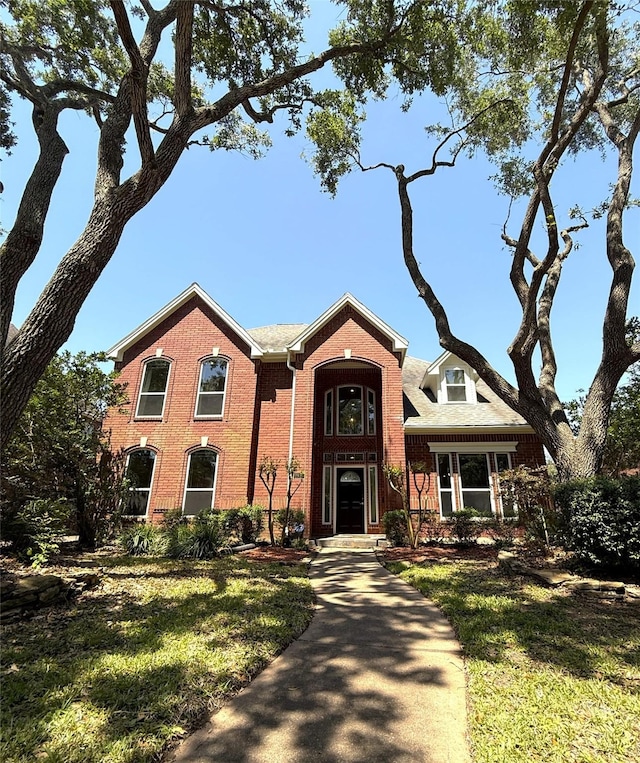 2810 Bright Trl, Sugar Land, TX 77479 - traditional-style house with brick siding and a front yard