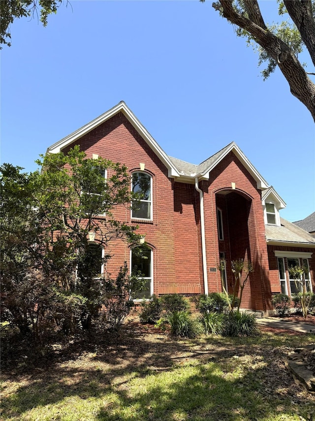 2810 Bright Trl, Sugar Land, TX 77479 - view of front facade with brick siding and a front lawn