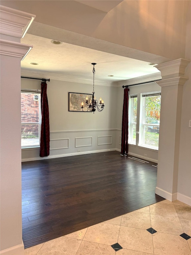 2810 Bright Trl, Sugar Land, TX 77479 - unfurnished dining area with ornamental molding, tile patterned flooring, healthy amount of natural light, and a chandelier