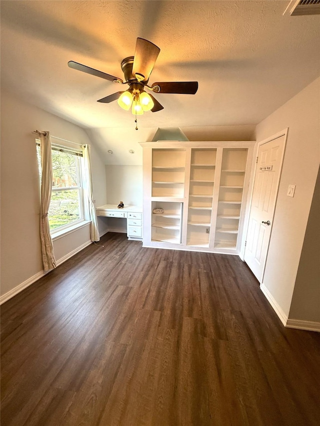 2810 Bright Trl, Sugar Land, TX 77479 - additional living space featuring dark wood-style flooring, lofted ceiling, baseboards, ceiling fan, and a textured ceiling