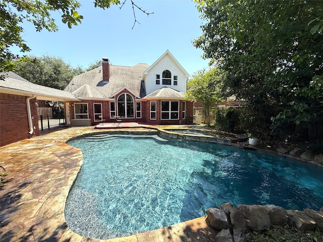 2810 Bright Trl, Sugar Land, TX 77479 - view of pool featuring fence, a patio, and a pool with connected hot tub