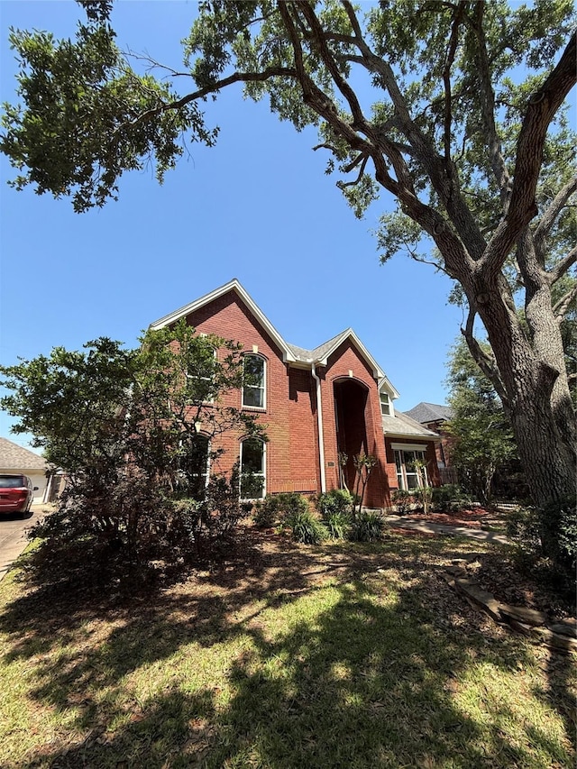 2810 Bright Trl, Sugar Land, TX 77479 - view of front facade with brick siding and a front lawn