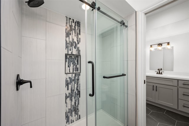 2744 Briarhurst Dr Unit 33, Houston, TX 77057 - bathroom with a shower stall, vanity, and tile patterned flooring