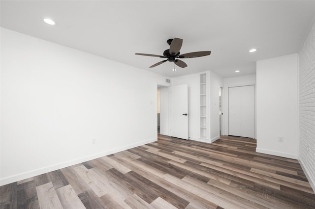 2744 Briarhurst Dr Unit 33, Houston, TX 77057 - unfurnished bedroom featuring wood finished floors, recessed lighting, baseboards, and ceiling fan