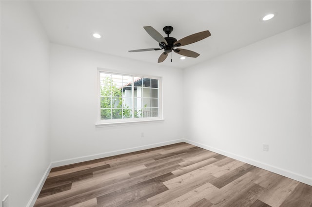 2744 Briarhurst Dr Unit 33, Houston, TX 77057 - spare room featuring wood finished floors, ceiling fan, recessed lighting, and baseboards