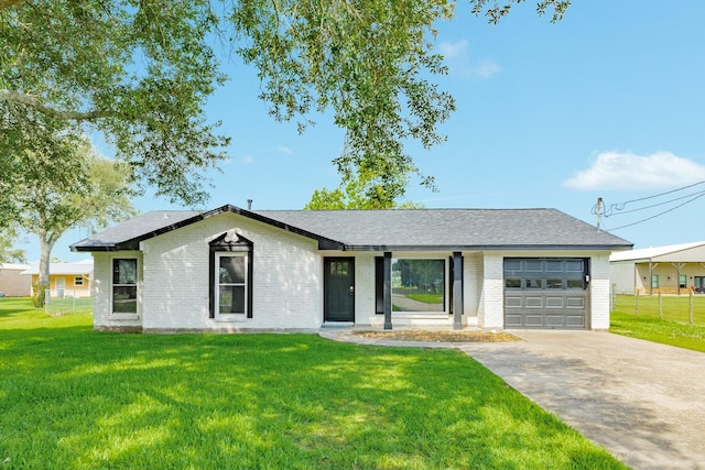 2735 County Road 208, Danbury, TX 77534 - view of front of house with brick siding, an attached garage, driveway, and roof with shingles