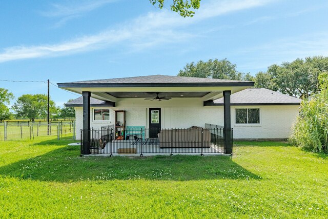 2735 County Road 208, Danbury, TX 77534 - back of property with ceiling fan, a patio, and brick siding