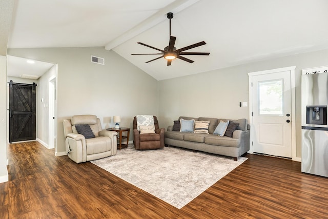 2735 County Road 208, Danbury, TX 77534 - living area featuring a barn door, dark wood finished floors, a ceiling fan, and baseboards