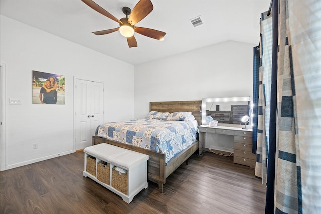 13215 Rowan Green Dr, Humble, TX 77346 - bedroom with dark wood finished floors, vaulted ceiling, ceiling fan, and baseboards