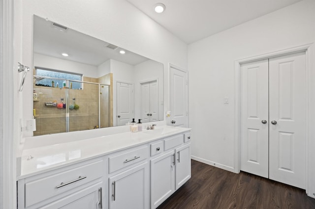13215 Rowan Green Dr, Humble, TX 77346 - bathroom with a shower stall, wood finished floors, vanity, recessed lighting, and baseboards