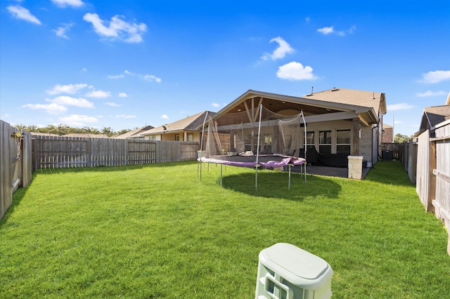 13215 Rowan Green Dr, Humble, TX 77346 - rear view of property featuring a trampoline