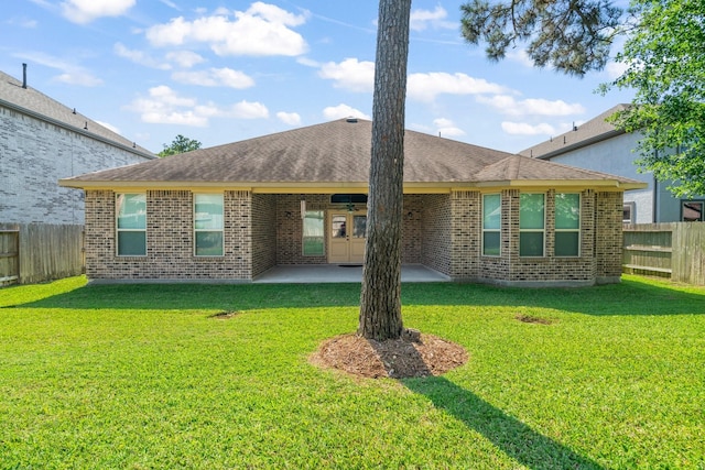 28010 Drifters Bend Dr, Spring, TX 77386 - back of property featuring brick siding, a patio, and a shingled roof