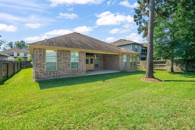 28010 Drifters Bend Dr, Spring, TX 77386 - back of property with brick siding, a patio area, and roof with shingles