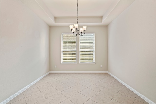 28010 Drifters Bend Dr, Spring, TX 77386 - empty room featuring a tray ceiling, a chandelier, light tile patterned floors, and baseboards