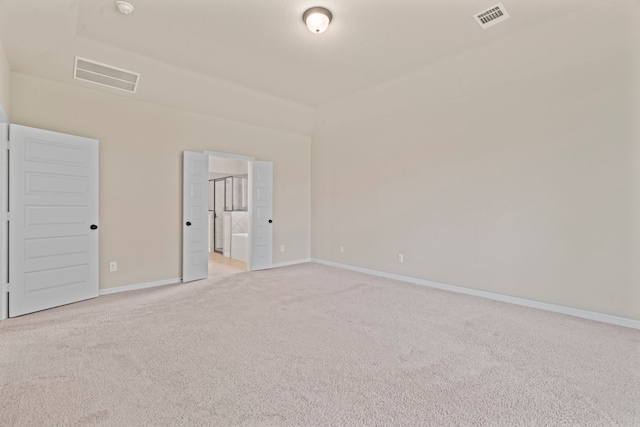 28010 Drifters Bend Dr, Spring, TX 77386 - unfurnished bedroom with light colored carpet, baseboards, and connected bathroom