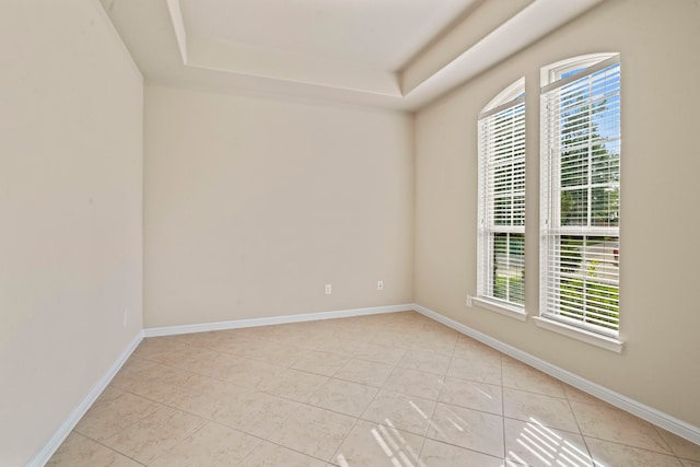 28010 Drifters Bend Dr, Spring, TX 77386 - spare room featuring light tile patterned floors, healthy amount of natural light, and a raised ceiling