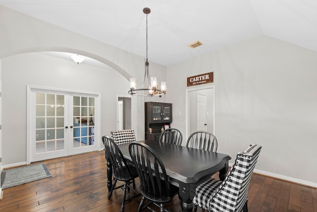 14123 Sherburn Manor Dr, Cypress, TX 77429 - dining room featuring arched walkways, hardwood / wood-style flooring, a chandelier, french doors, and lofted ceiling