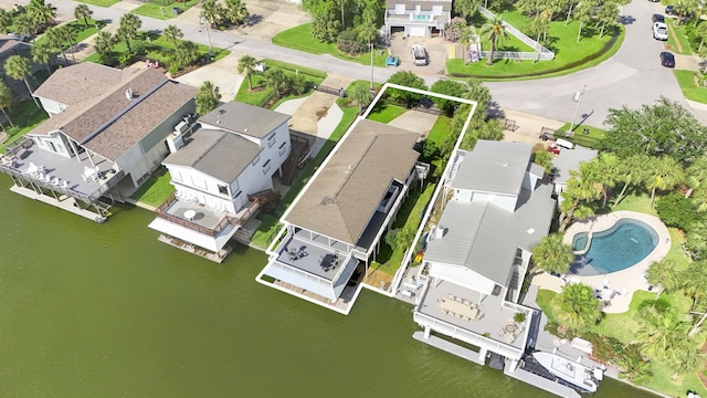 4209 W Bayside Way, Jamaica Beach, TX 77554 - aerial perspective of suburban area with property boundaries highlighted, a large body of water, and a pool area