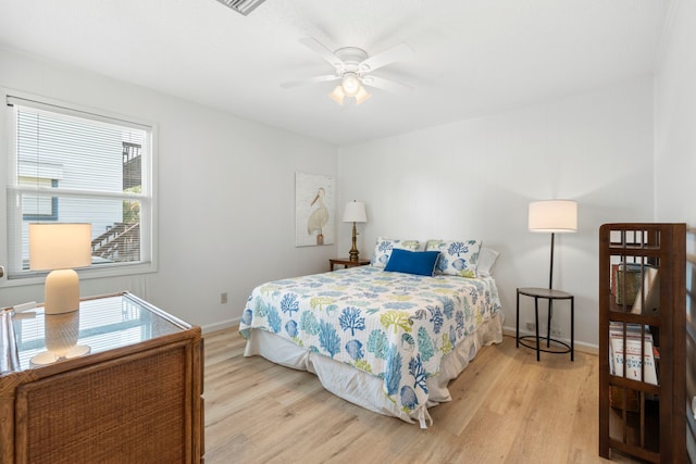 4209 W Bayside Way, Jamaica Beach, TX 77554 - bedroom featuring light wood-type flooring, baseboards, and ceiling fan