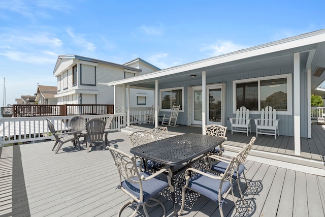 4209 W Bayside Way, Jamaica Beach, TX 77554 - deck featuring outdoor dining space