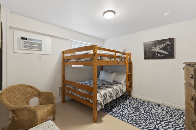 4209 W Bayside Way, Jamaica Beach, TX 77554 - bedroom featuring baseboards and a wall mounted air conditioner