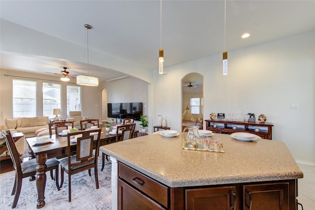 19503 Sundance Edge Ct, Richmond, TX 77407 - kitchen with a ceiling fan, arched walkways, plenty of natural light, and open floor plan