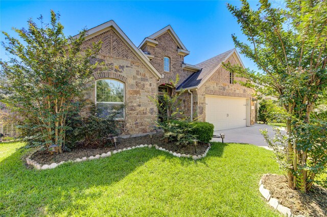 19503 Sundance Edge Ct, Richmond, TX 77407 - view of front of home with stone siding, a front lawn, and concrete driveway