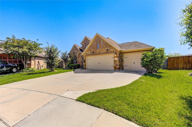19503 Sundance Edge Ct, Richmond, TX 77407 - view of front of home with concrete driveway, a garage, stone siding, and brick siding