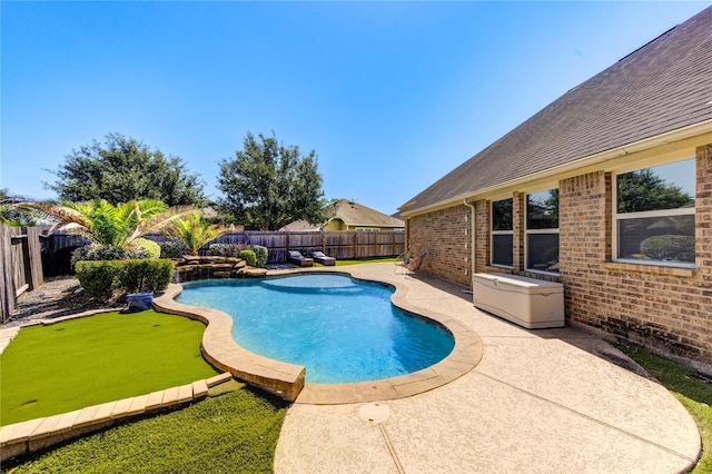 19503 Sundance Edge Ct, Richmond, TX 77407 - view of pool featuring a fenced backyard, a patio area, and a putting green