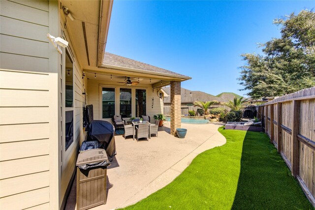 19503 Sundance Edge Ct, Richmond, TX 77407 - view of patio featuring a ceiling fan and outdoor lounge area