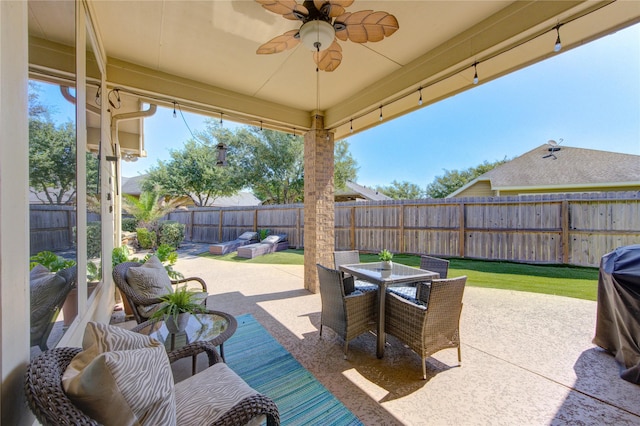 19503 Sundance Edge Ct, Richmond, TX 77407 - view of patio / terrace with ceiling fan, a fenced backyard, outdoor dining space, and an outdoor living space