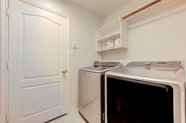 19503 Sundance Edge Ct, Richmond, TX 77407 - laundry room with independent washer and dryer and light tile patterned flooring