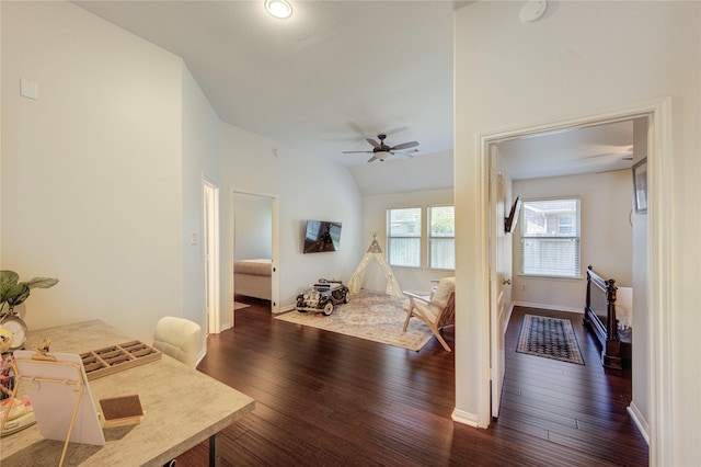 19503 Sundance Edge Ct, Richmond, TX 77407 - living room with dark wood-style flooring, lofted ceiling, a ceiling fan, and baseboards