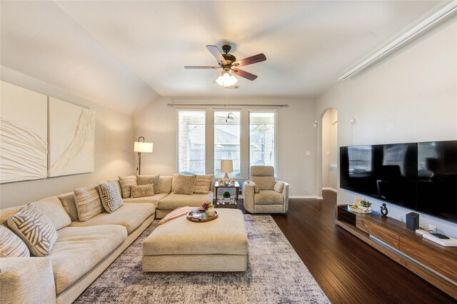 19503 Sundance Edge Ct, Richmond, TX 77407 - living area with arched walkways, a ceiling fan, dark wood-style floors, and baseboards
