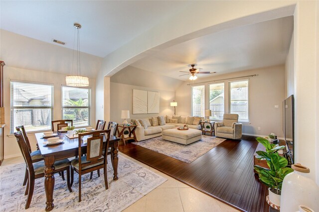 19503 Sundance Edge Ct, Richmond, TX 77407 - tiled dining area with ceiling fan, arched walkways, and baseboards
