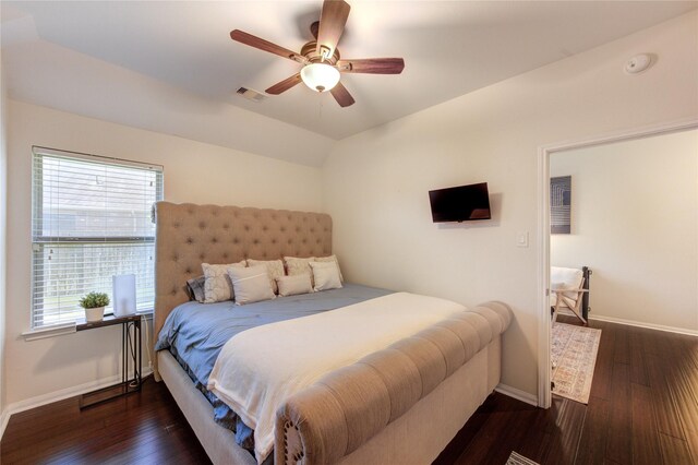 19503 Sundance Edge Ct, Richmond, TX 77407 - bedroom with baseboards, multiple windows, wood finished floors, and lofted ceiling