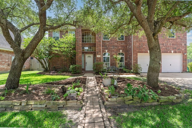 13506 Scenic Glade Dr, Houston, TX 77059 - view of front facade with an attached garage, concrete driveway, and brick siding