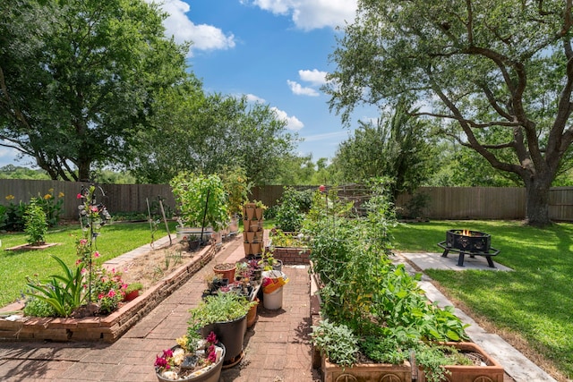 13506 Scenic Glade Dr, Houston, TX 77059 - view of yard with a fire pit, a garden, and a patio area