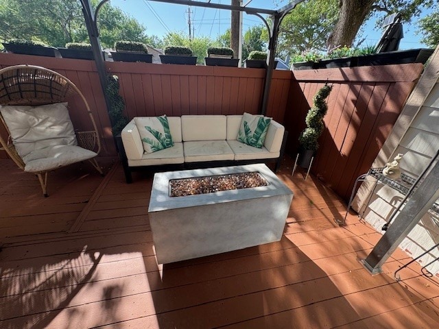 2211 S Kirkwood Rd Unit 1, Houston, TX 77077 - wooden terrace featuring a fenced backyard and an outdoor living space with a fire pit