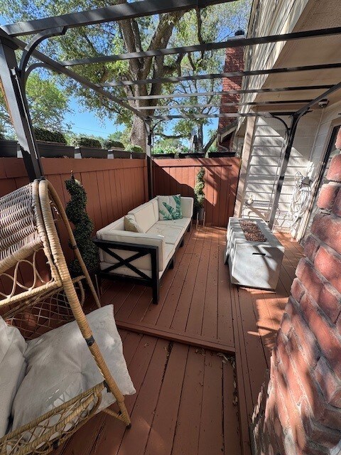 2211 S Kirkwood Rd Unit 1, Houston, TX 77077 - wooden terrace featuring outdoor lounge area and a fenced backyard