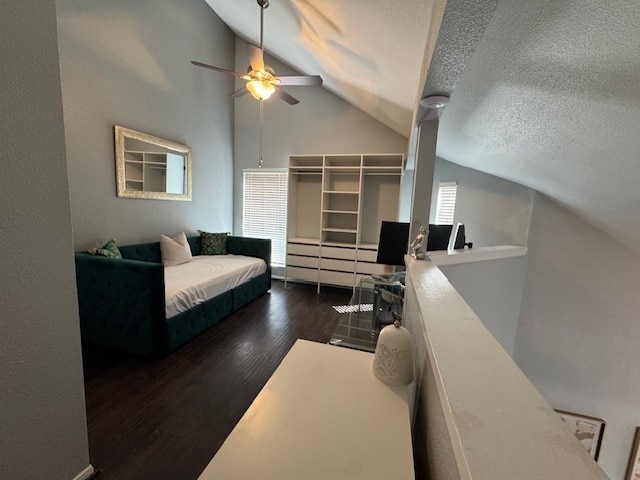 2211 S Kirkwood Rd Unit 1, Houston, TX 77077 - living room with lofted ceiling, a textured ceiling, a ceiling fan, and wood finished floors