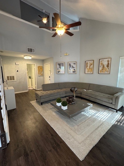 2211 S Kirkwood Rd Unit 1, Houston, TX 77077 - living area with a ceiling fan, dark wood-style floors, a high ceiling, and baseboards