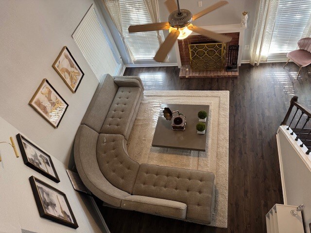 2211 S Kirkwood Rd Unit 1, Houston, TX 77077 - living area with wood finished floors, ceiling fan, and plenty of natural light