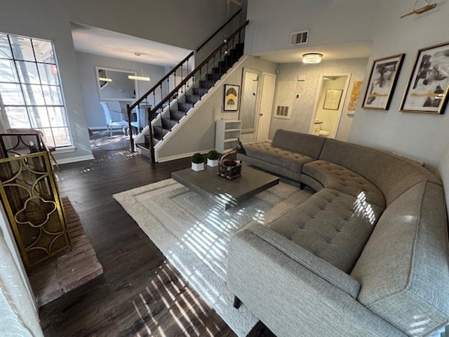 2211 S Kirkwood Rd Unit 1, Houston, TX 77077 - living area featuring stairway, wood finished floors, and baseboards