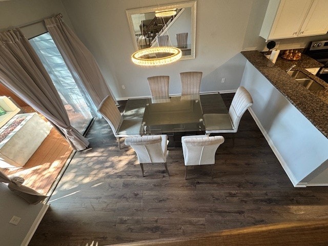 2211 S Kirkwood Rd Unit 1, Houston, TX 77077 - dining area featuring dark wood-style floors and baseboards