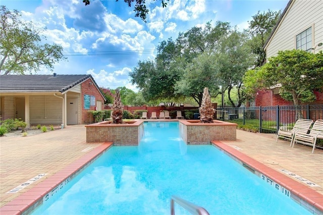 2211 S Kirkwood Rd Unit 1, Houston, TX 77077 - community pool with a patio area and a fenced backyard