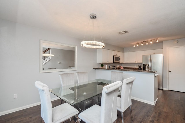 2211 S Kirkwood Rd Unit 1, Houston, TX 77077 - dining area with dark wood finished floors and baseboards