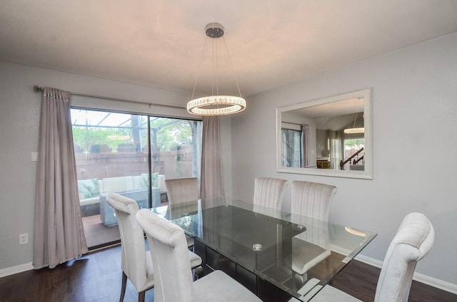 2211 S Kirkwood Rd Unit 1, Houston, TX 77077 - dining area featuring a chandelier and dark wood-style flooring