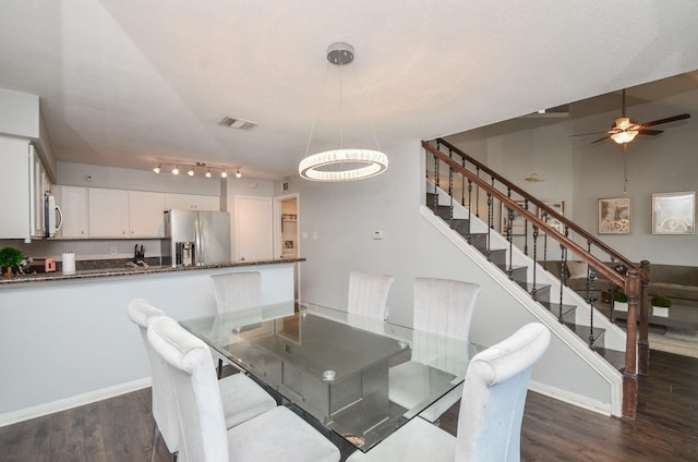 2211 S Kirkwood Rd Unit 1, Houston, TX 77077 - dining room with dark wood-type flooring, stairs, a ceiling fan, and a chandelier