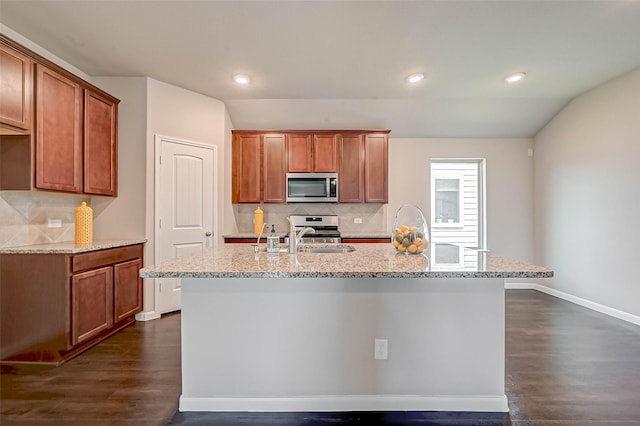 21622 Sage Landing Ln, Katy, TX 77449 - kitchen with stainless steel appliances, dark wood-type flooring, backsplash, light stone counters, and recessed lighting